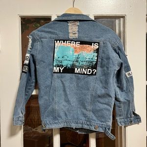 Trendy jean jacket, size small but fits like an extra small! Real safety pins.